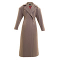 Long beige full-length coat with padded shoulders