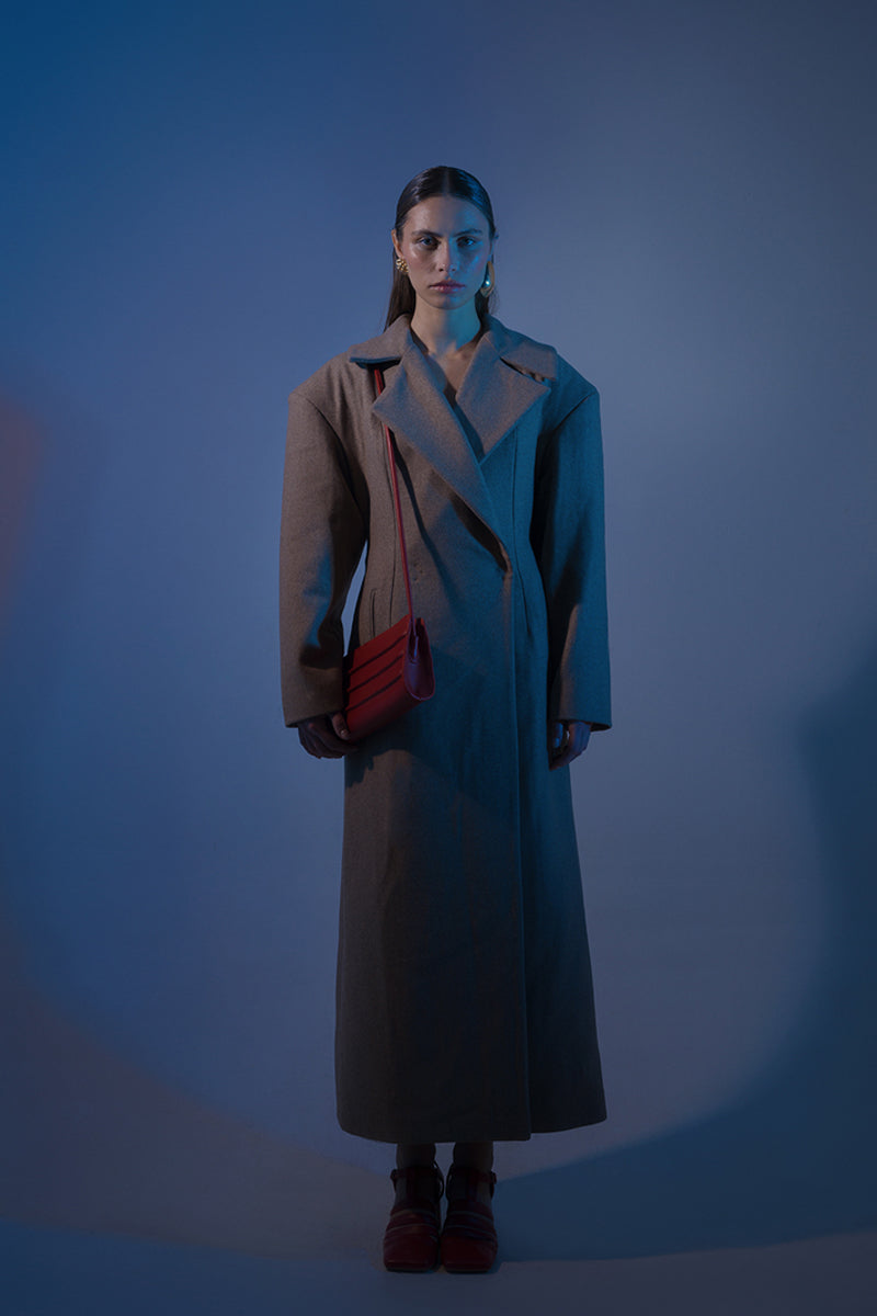 Long beige full-length coat with padded shoulders