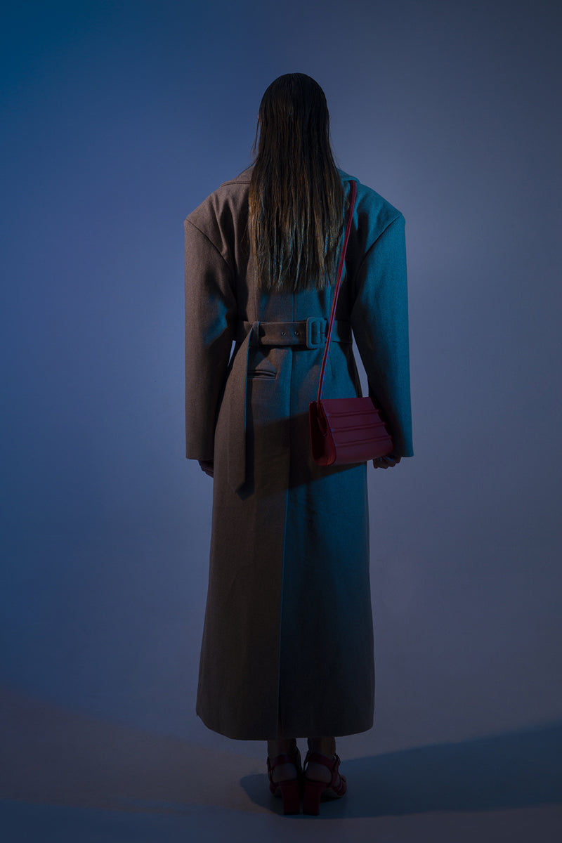 Long beige full-length coat with padded shoulders