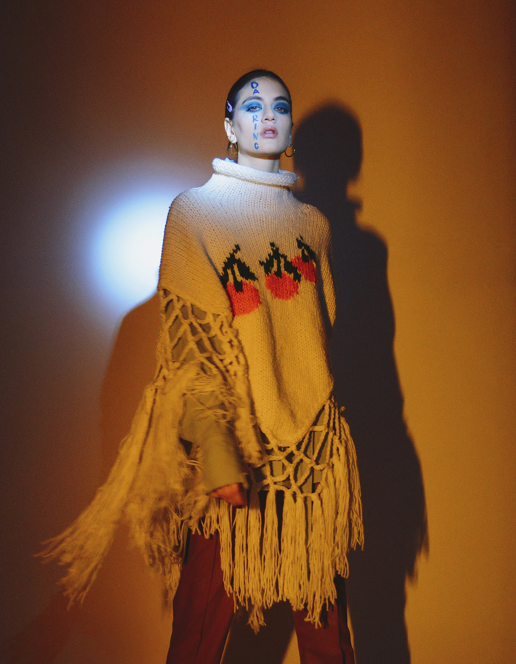 Knitted tangerine poncho
