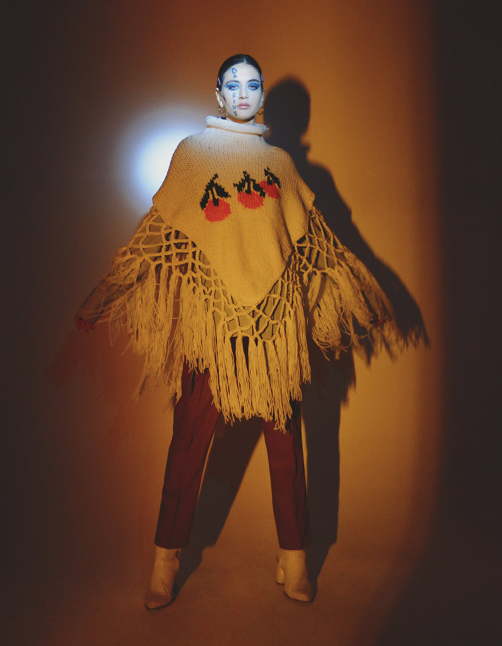 Knitted tangerine poncho
