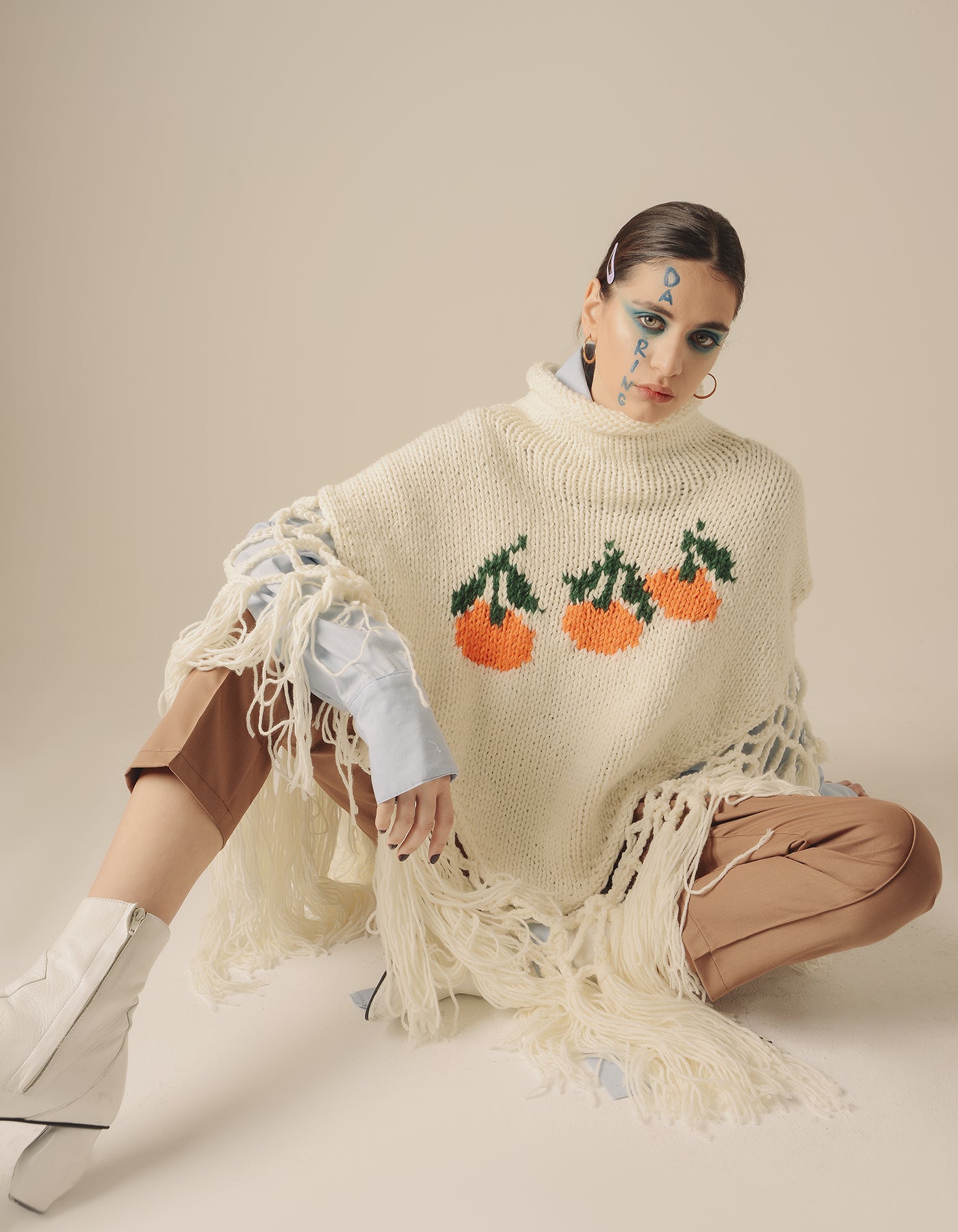 Knitted tangerine poncho