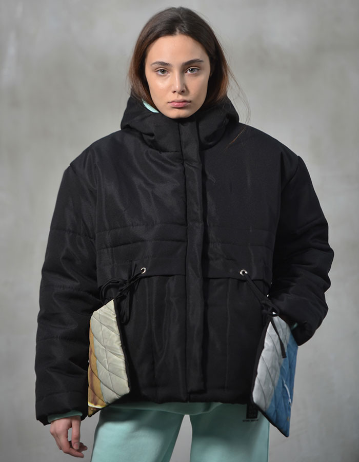 Black puffer jacket with attached colorful pockets