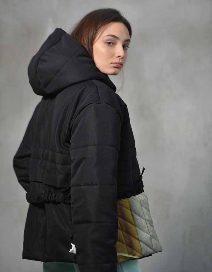 Black puffer jacket with attached colorful pockets
